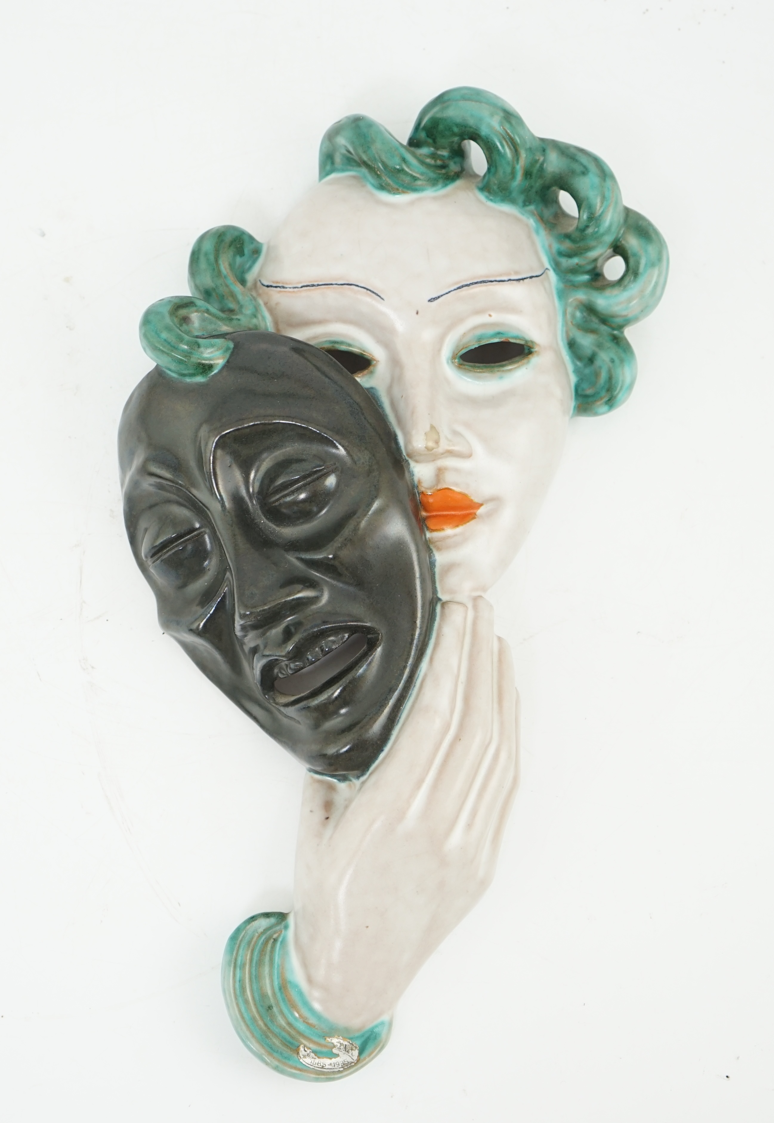 An Art Deco tin-glazed terracotta theatrical wall mask, by Goldscheider